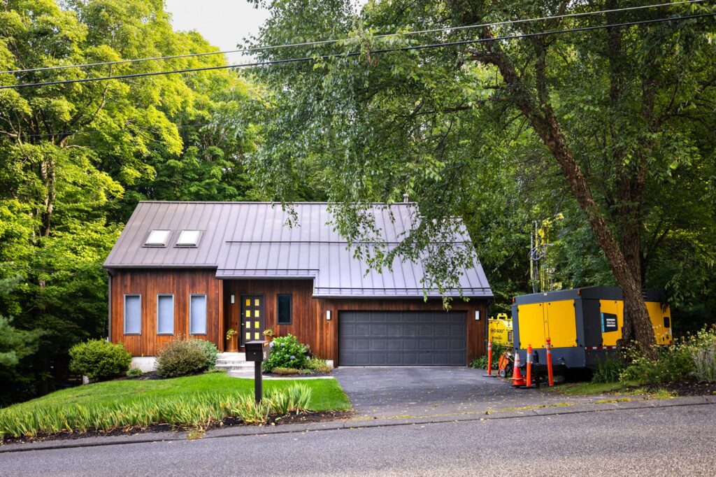 Residential Geothermal: borehole on the side of the house