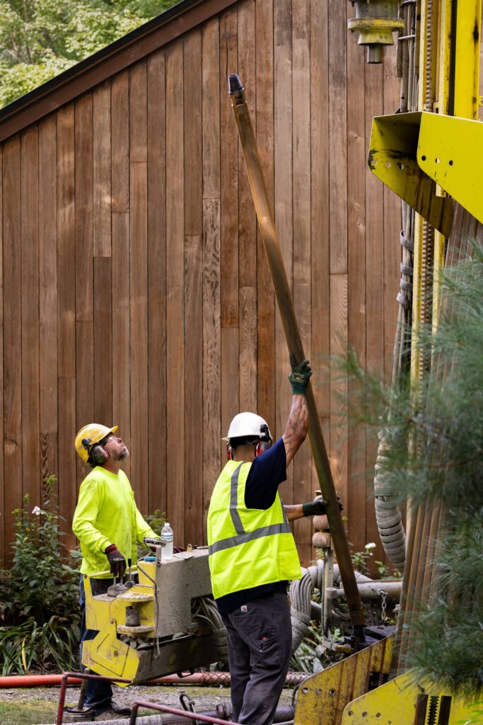 Image of drilling team member moving rod without any external equipment